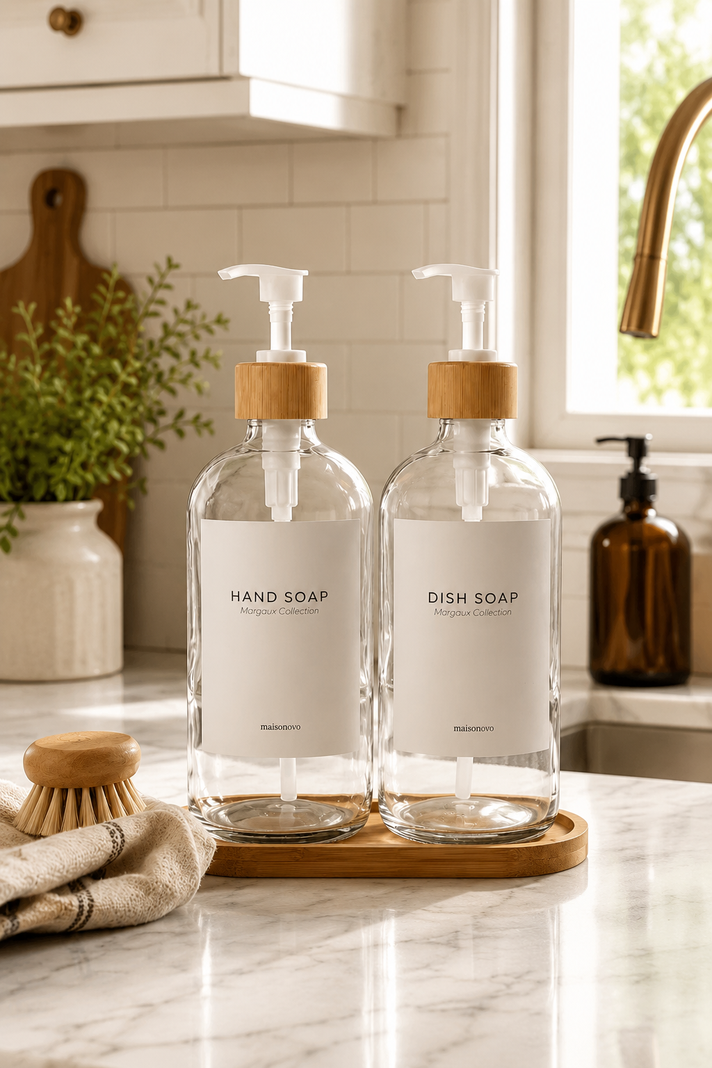 Clear glass soap dispensers with bamboo pumps on tray